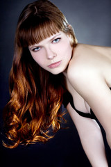 Fototapeta premium Beautiful young sexy woman on dark background.