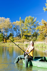 fishing woman sitting on boat