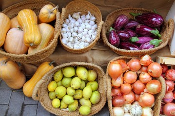 Naklejka na ściany i meble fruits and vegetables market garlic onion lemon eggplant