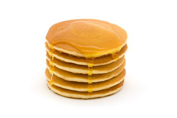 Stack of pancakes over white with syrup