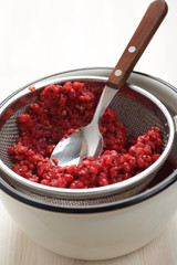 Cooking red currant jelly