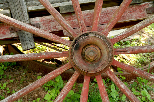 Old weathered red wagon wheel