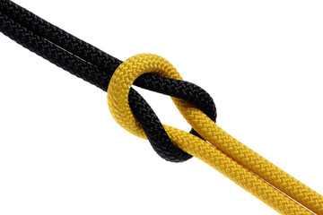 Reef-knot of black and yellow rope
