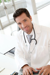 Portrait of young doctor at work