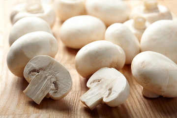 Champignon on wooden background