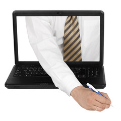 Person signing document from laptop.