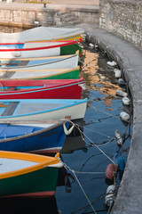 Fototapeta na wymiar colourful boats in torri del benaco