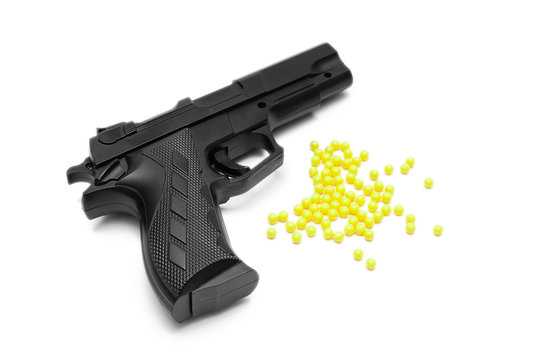 Toy gun with pellets isolated