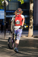 Fototapeta na wymiar young man with a bike in one hand ...
