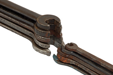 Stack of old rusty wrench, isolated on white background