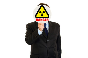 Сoncept- radiation danger! Businessman holding radiation sign