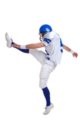 Fototapeta na wymiar American football player kicking