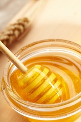 Honey with wood stick