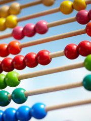 Children abacus in front of blue sky