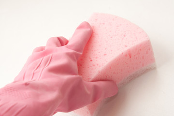 Hand in rubber glove holding sponge