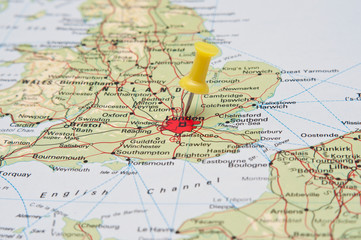 Fototapeta na wymiar Push pin pointing at London, England on a map