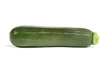 Courgette or zucchini, side view and isolated on white.