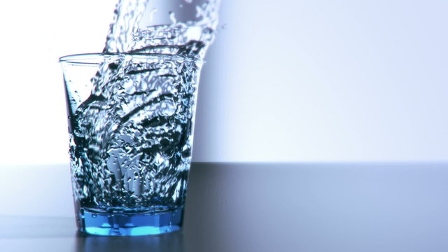 pouring cup of water