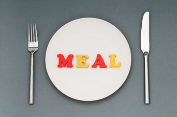 Plate with letters on the white background