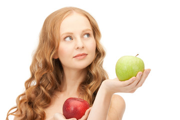 young beautiful woman with green and red apples