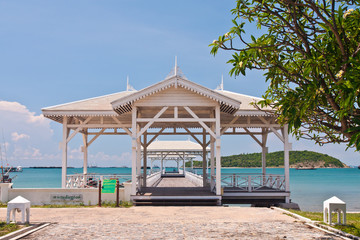 White bridge in to the sea from front