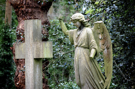 Angel and cross statues in Hampstead Heath, London