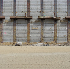 concrete wall and sand road on a large construction site