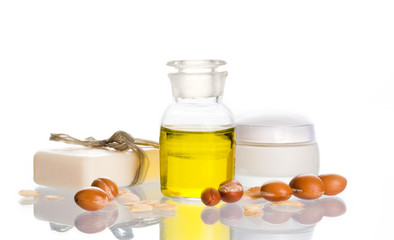 Argan oil with cosmetic products and fruits