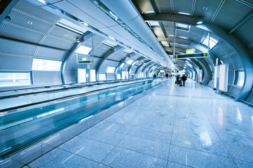 indoor walkway with blurred people