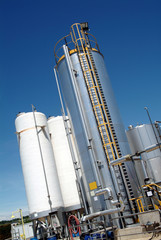chemistry factory, outdoor photo with metal tanks