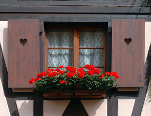 Fototapeta na wymiar window with hearts and flowers