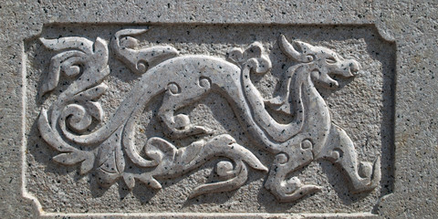 Dragon carved on stone wall