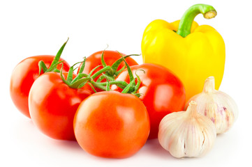 Food background: Fresh ripe tomatoes, yellow pepper and garlic