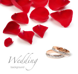 wedding rings and roses petals