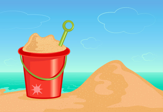 Bucket of sand on the beach