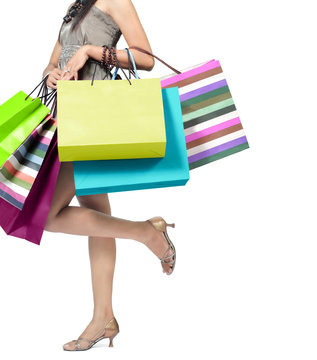 woman carrying a lot of shopping bags