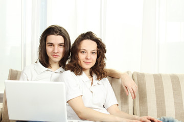 Couple on a couch, browsing