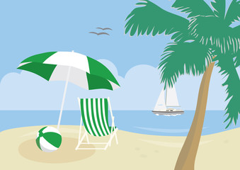 Deck chair, beach ball and umbrella on a tropical beach