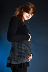 Cute pregnant woman smiling