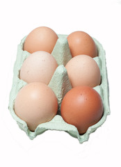 Six eggs in a box isolated on white
