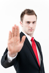 young businessman showing stop gesture