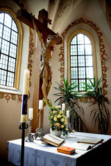 Holy Bible and Flowers on altar in the church