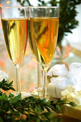 Champagne in glasses and green twig