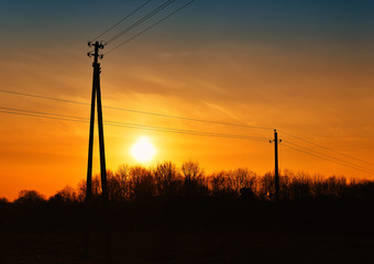 Fototapeta na wymiar Electrical power lines sunset