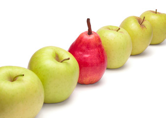 Ripe red pear and green apples in diagonal