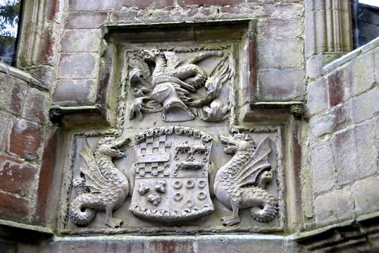 A Carved Stone Coat of Arms on a medieval castle wall