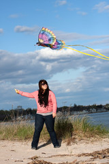 Girl Flying a Kite at the Beach