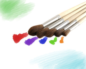 painting brushes isolated on white with blue and green spots