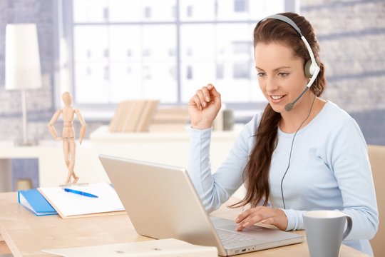 Attractive customer servicer working in office