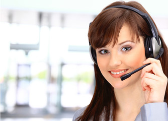 Young and smiling operator isolated over light background.